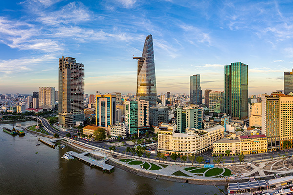 Ho Chi Minh City skyline with Bitexco Tower and Saigon River.